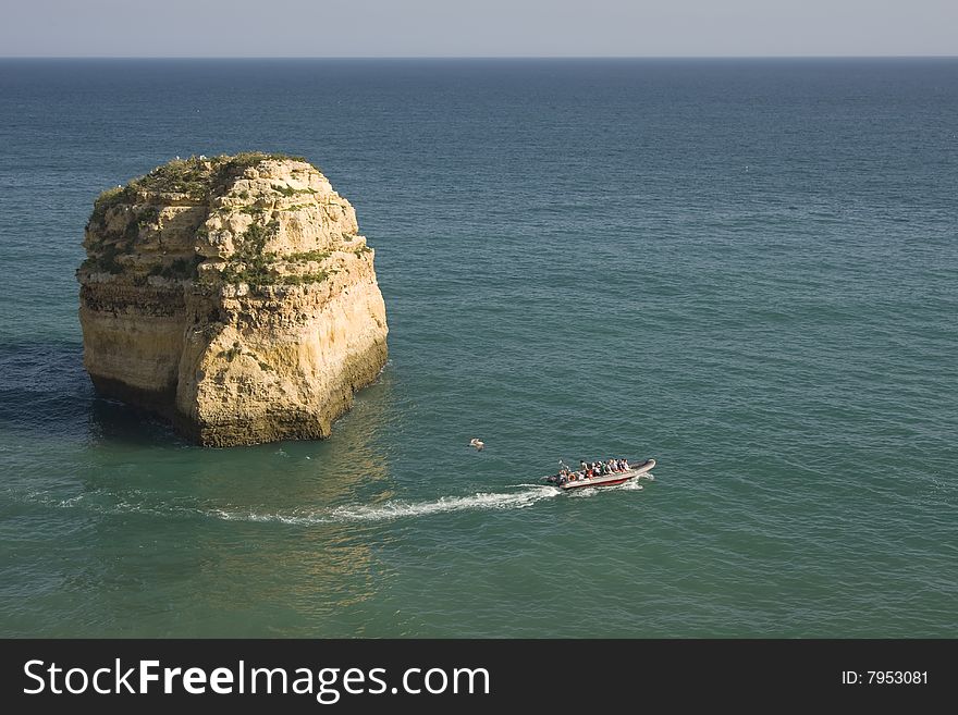 Boat in a beautiful seascape at Algarve region, Portugal. Boat in a beautiful seascape at Algarve region, Portugal