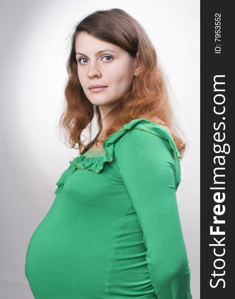 Studio portrait of a beautiful pregnant woman. Studio portrait of a beautiful pregnant woman