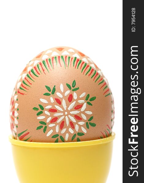 Hand painted Easter Egg with pagan ornaments on white.