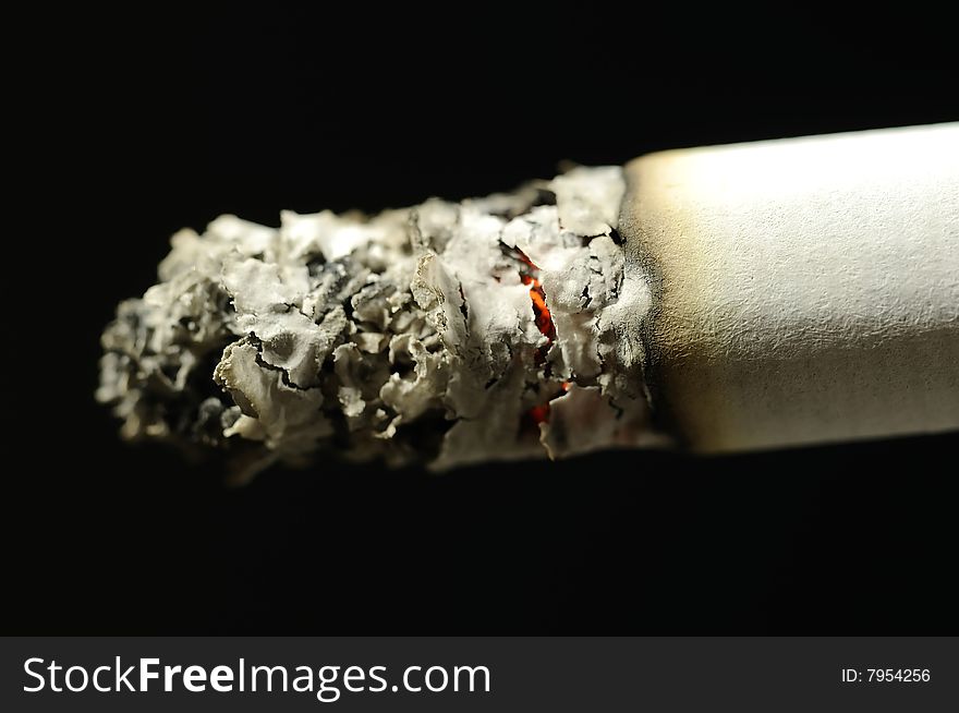 Macro photo of a burning cigarette tip. Macro photo of a burning cigarette tip