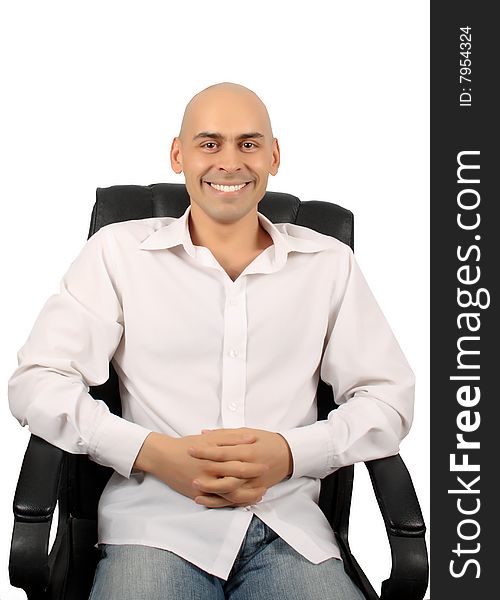 Bald handsome man in armchair isolated over white