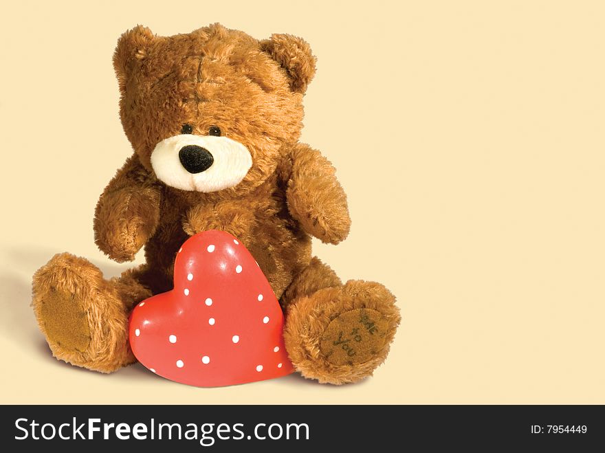 Brown teddy bear with heart