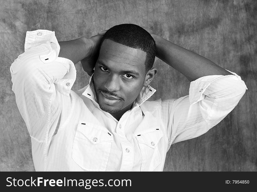 Young African American male model posing in studio. Young African American male model posing in studio.