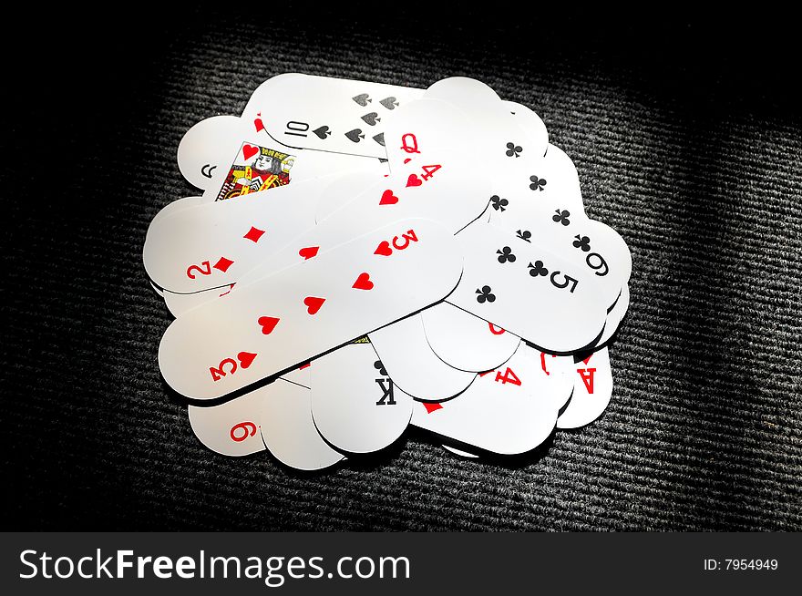 Playing cards isolated on textured background.