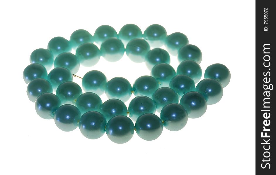 Beads from blue pearls on a white background. Beads from blue pearls on a white background