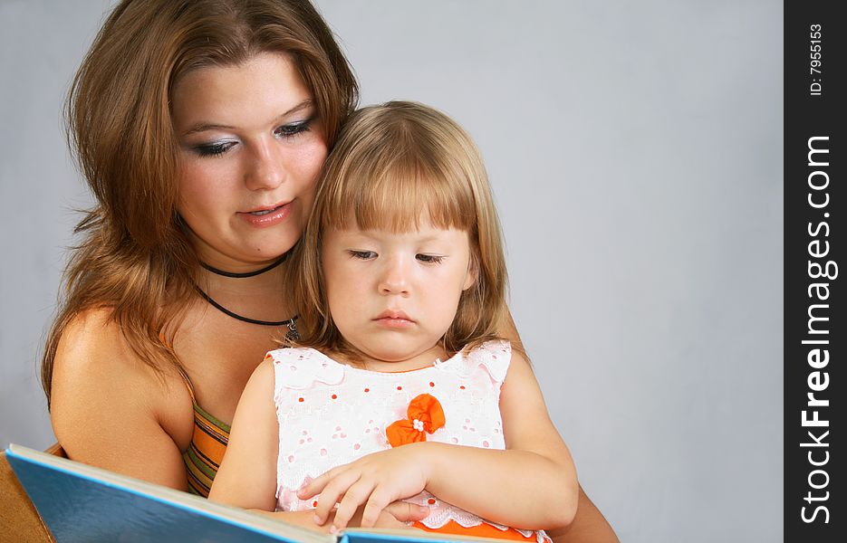 Two sisters read the book