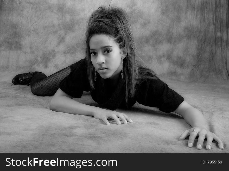 Young woman African American model posing in studio. Young woman African American model posing in studio.