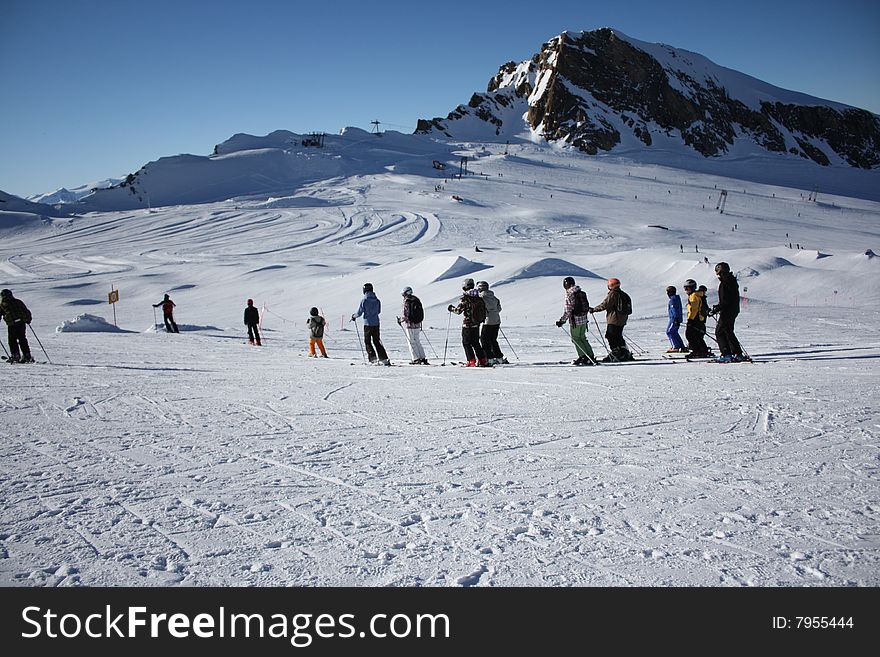 Austria. Mountains. The Alpes.Skiers on a mountain slope.