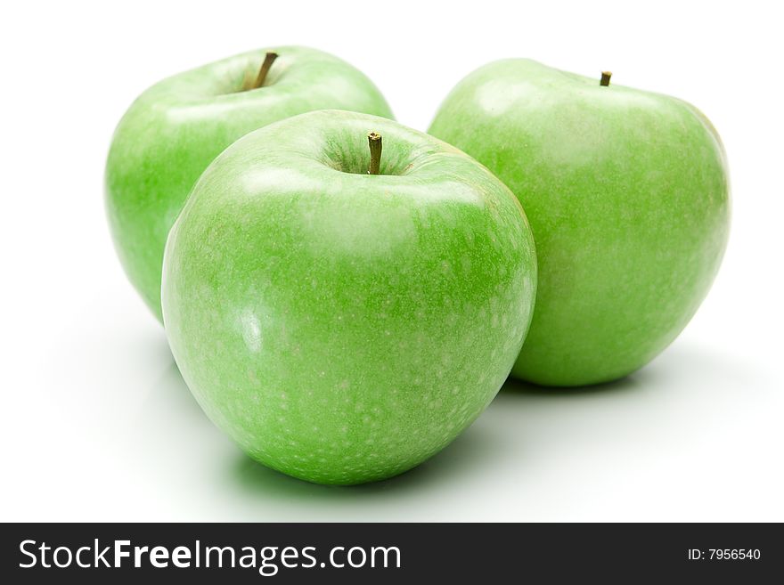 Three green apples isolated over white