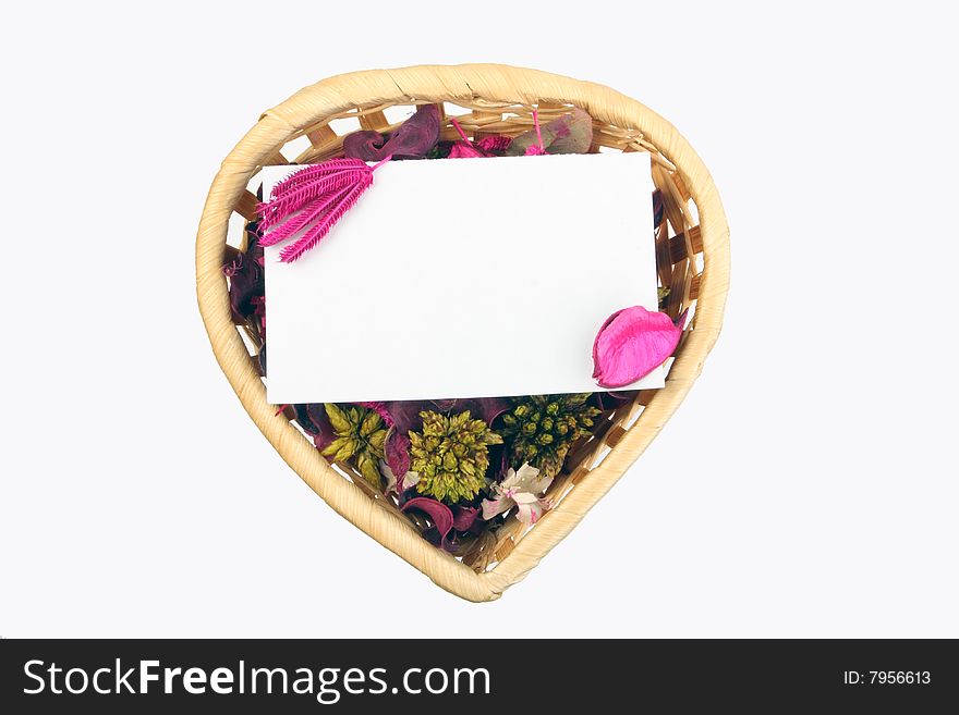 Heart-shaped basket with small clear sheet and flowers. Heart-shaped basket with small clear sheet and flowers