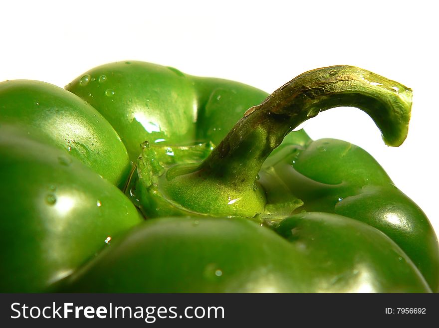 Green paprika close up over white background. Green paprika close up over white background