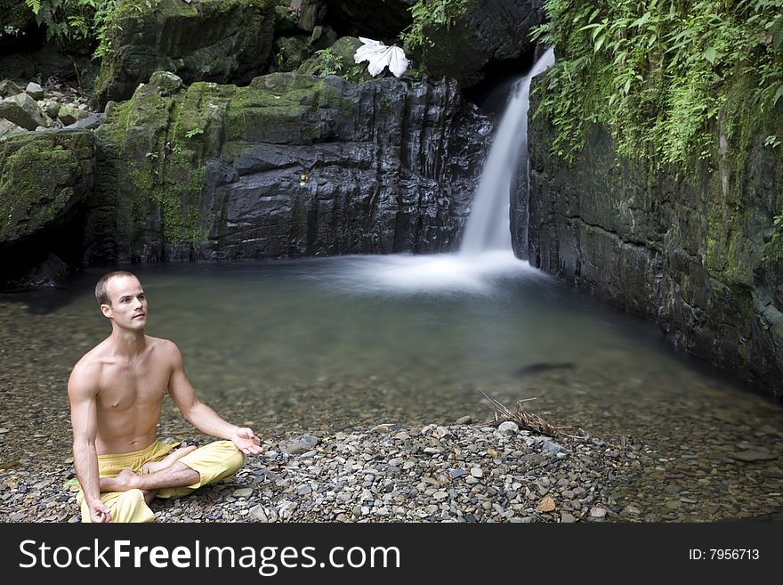 A Yoga Pose Next To A Rainforest Shower