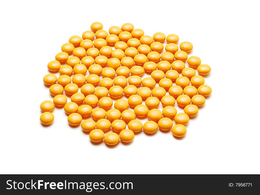 Yellow pills isolated on white