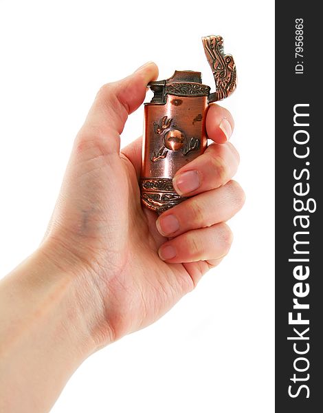 Female Hand Holds Old Bronze Gas Lighter