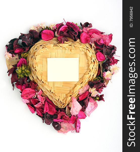 Heart-shaped basket with small clear sheet and flowers. Heart-shaped basket with small clear sheet and flowers