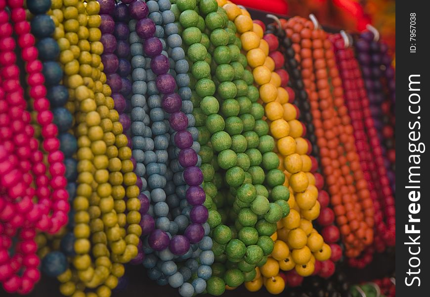 Wooden bead necklaces on a market stall. Wooden bead necklaces on a market stall