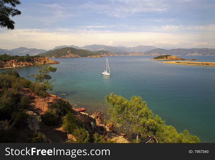 Anchored yacht at beautiful coast in mediteranian sea