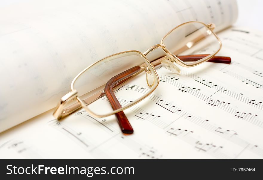 Close up image of glasses on book. Close up image of glasses on book