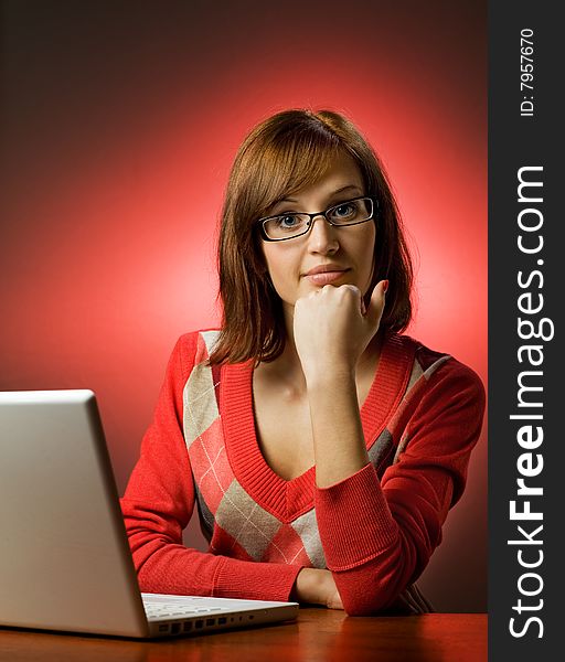 Beautiful young woman working on her laptop