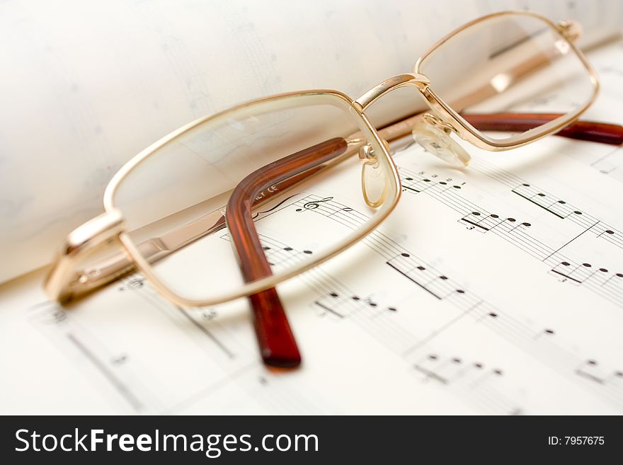 Close up image of glasses on book. Close up image of glasses on book