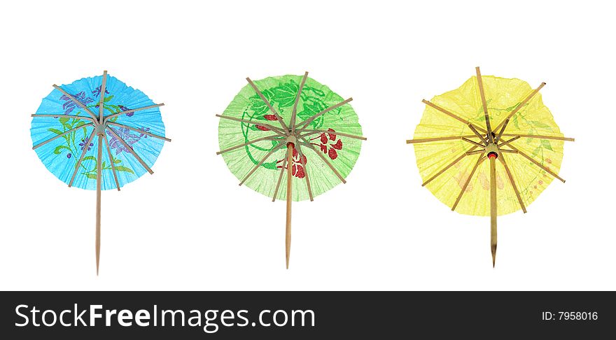 Cocktail umbrellas isolated on white.