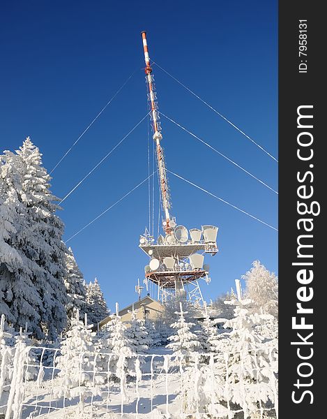 Communication station on a mountain peak in winter. Communication station on a mountain peak in winter