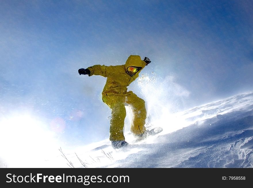 Snowboarder on the top of mountain