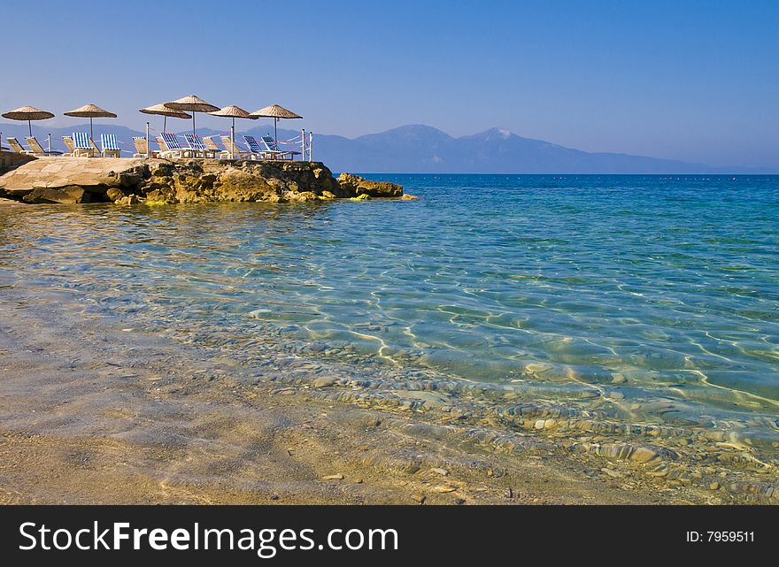 Sunshades in Turkish resort in the Aegean sea