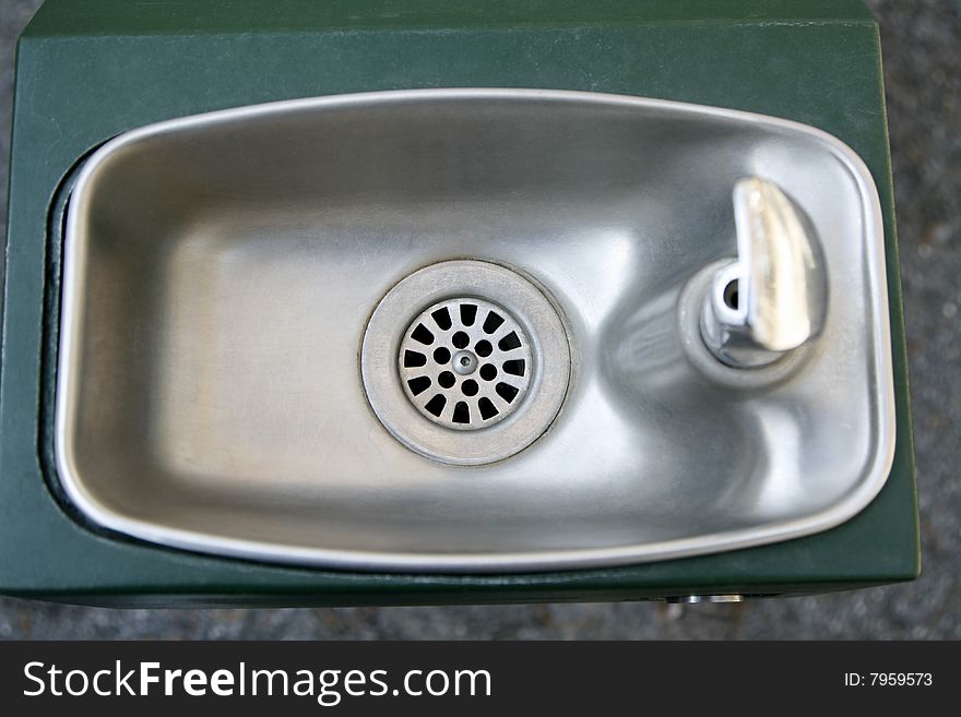 A stainless steel drinking fountain sink bowl basin.