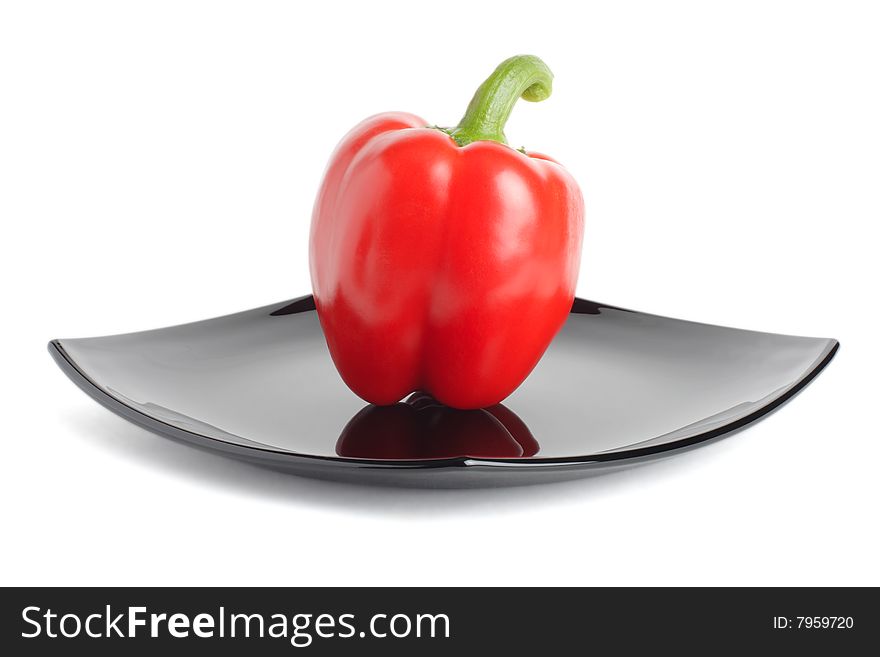 Red Pepper On A Black Plate
