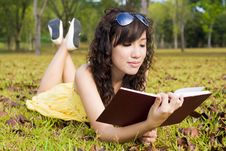 Girl Reading Book In The Outdoors Stock Images Girl Reading Book In The Outdoors Stock Images