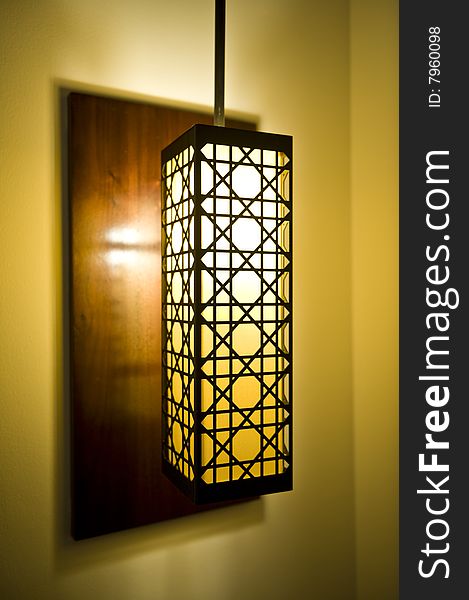 A decorative lamp shade in a luxurious hotel room.