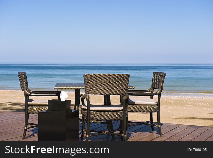 Romantic restaurant setting on a deck on the beach. Romantic restaurant setting on a deck on the beach.