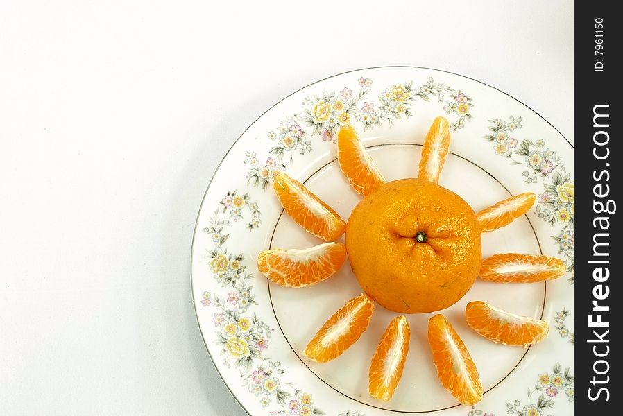 Tangerine placed on the desktop of the intraday