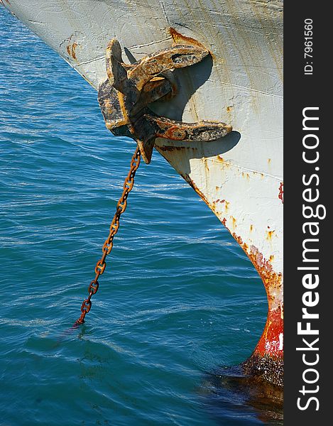 Rusty anchor and chain at the seaport