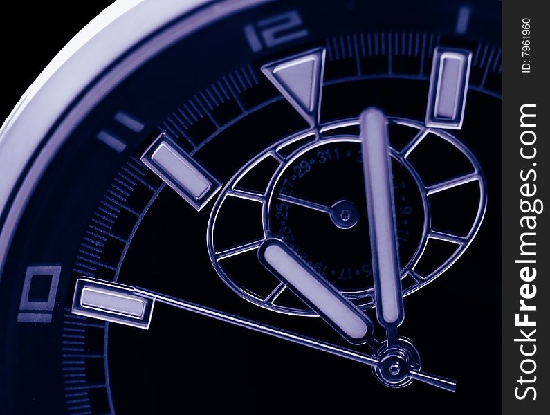 Time background showing hour minute and second hands of a watch taken at extreme closeup magnification