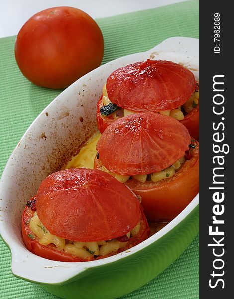 Baked tomatoes with macaroni filling