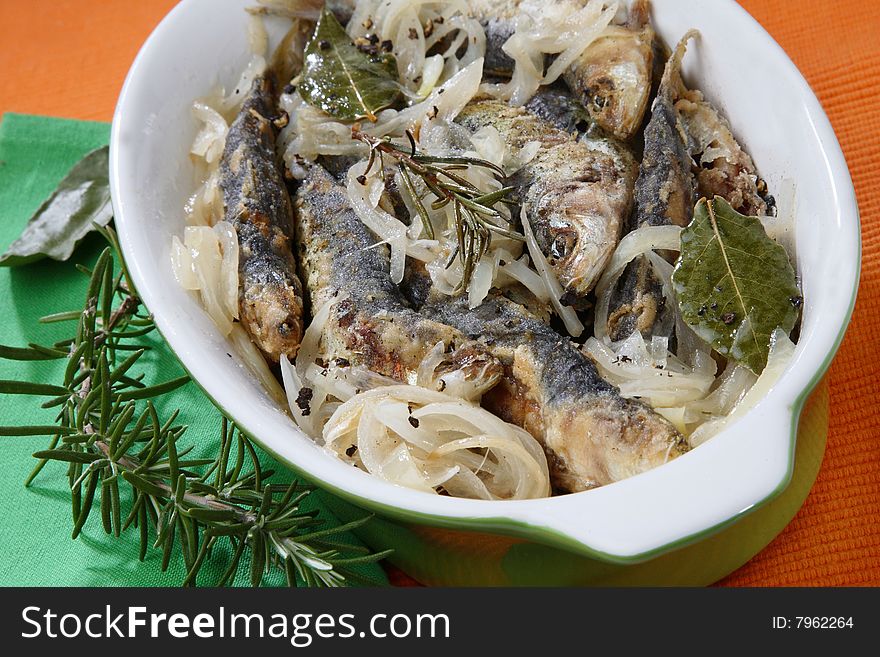 Anchovies with spice vegetable on plate