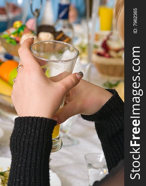 Glass with fruit juice in female hands. Glass with fruit juice in female hands.