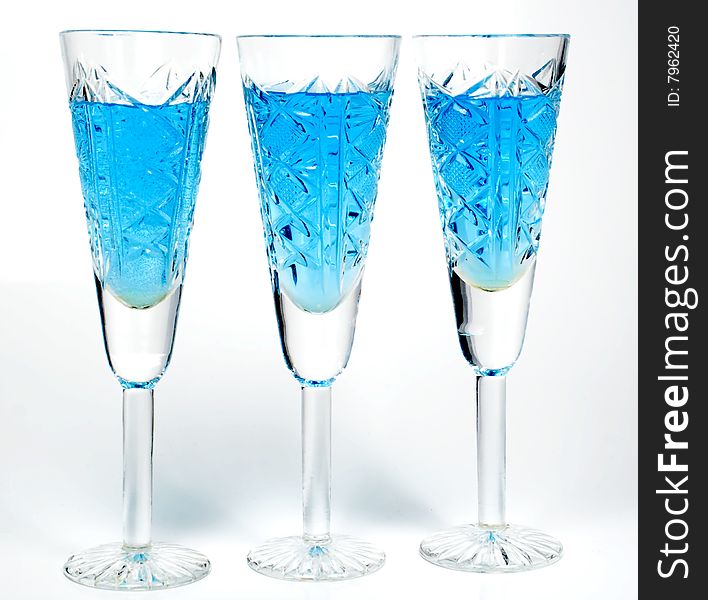 Three wineglass with drink blue colors