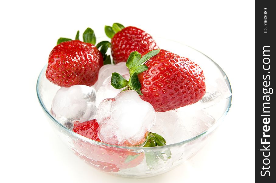 Strawberries  with ice in bowl on white ground. Strawberries  with ice in bowl on white ground