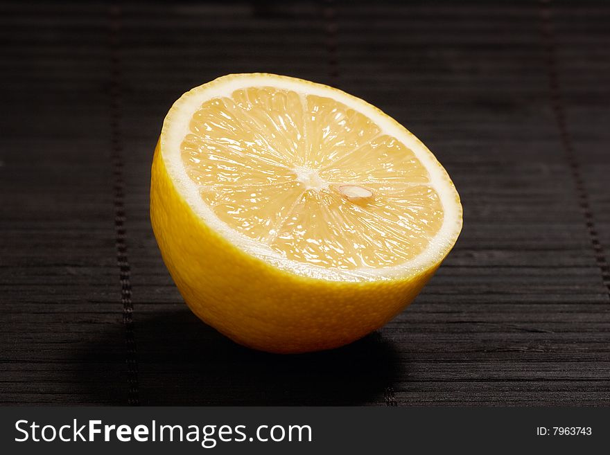 Lemon slice on dark background