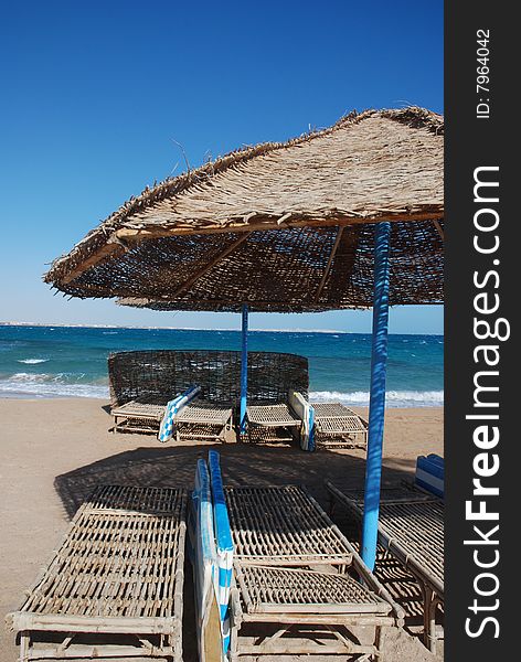 Umbrella on the beach with sea behind