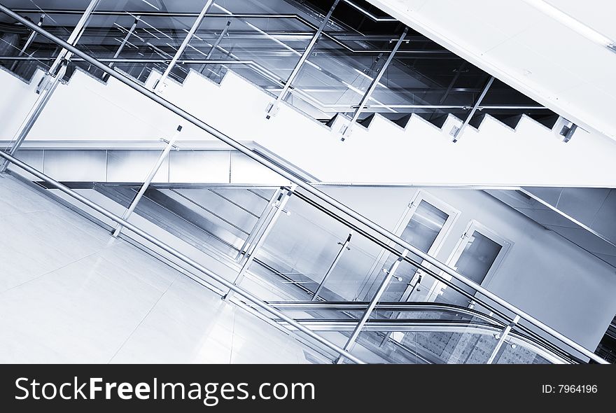 Escalator and stairs in the business center. Escalator and stairs in the business center