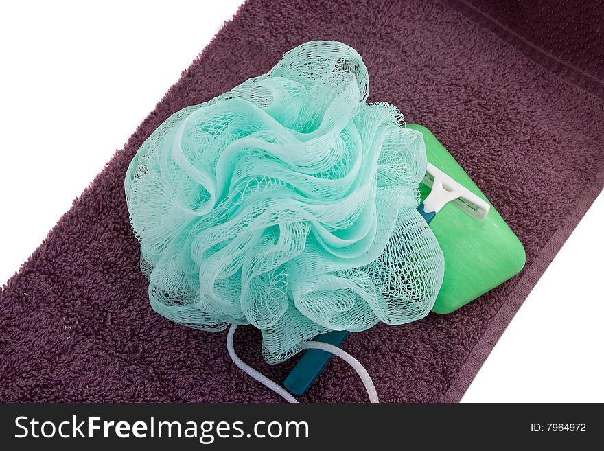 Everything a lady needs for a bath � soap, scrubby and razor � on a white background. Everything a lady needs for a bath � soap, scrubby and razor � on a white background.