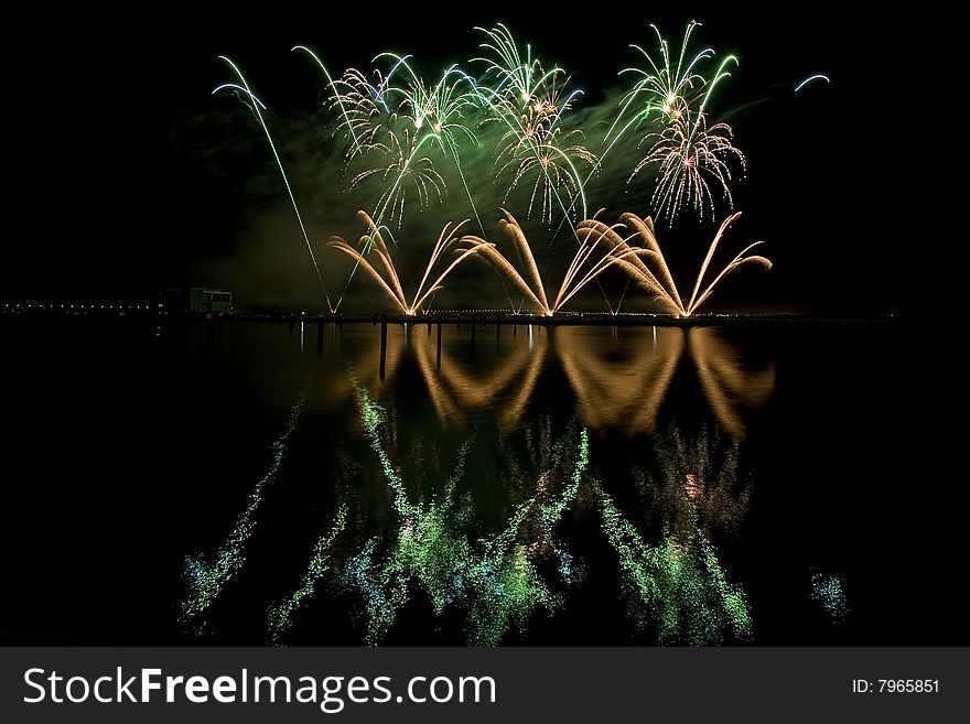 Long exposure of multiple fireworks against a black sky