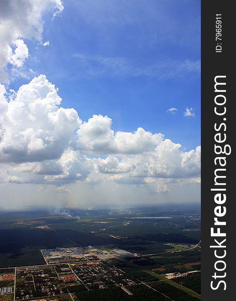 Aerial view of cloudscape over a cityscape.