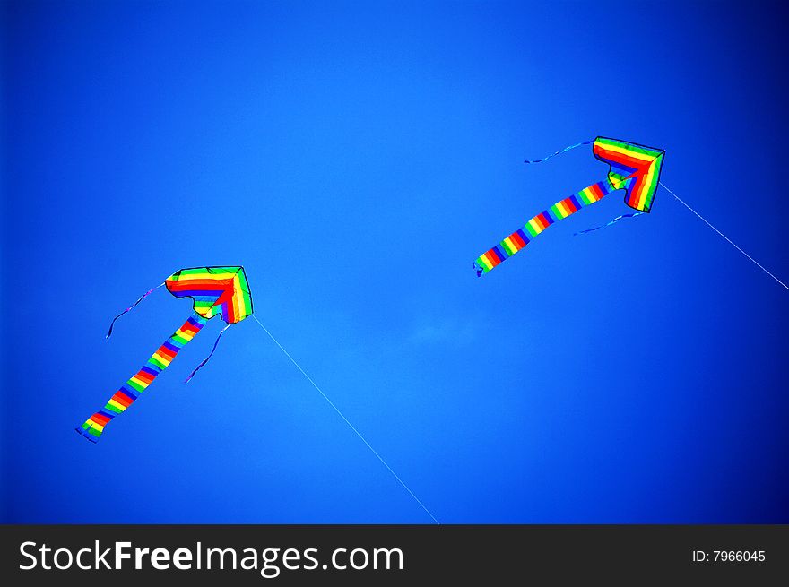Two kites flew high in the sky. Two kites flew high in the sky