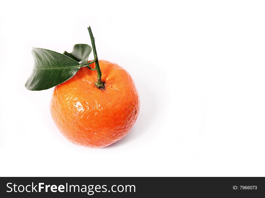 Mandarin orange with green leaf, on white background