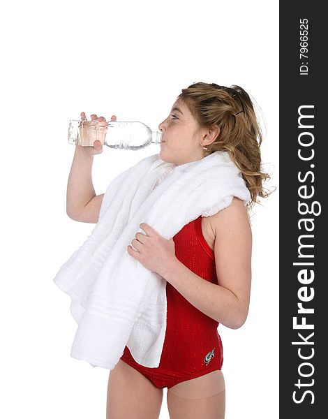 Girl in red leotard drinking water after working out. Girl in red leotard drinking water after working out